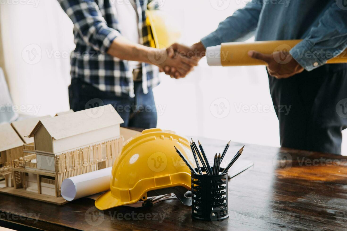 Engineer Teamwork Meeting, Drawing working on blueprint meeting for project working with partner on model building and engineering tools in working site, Construction and structure concept. photo