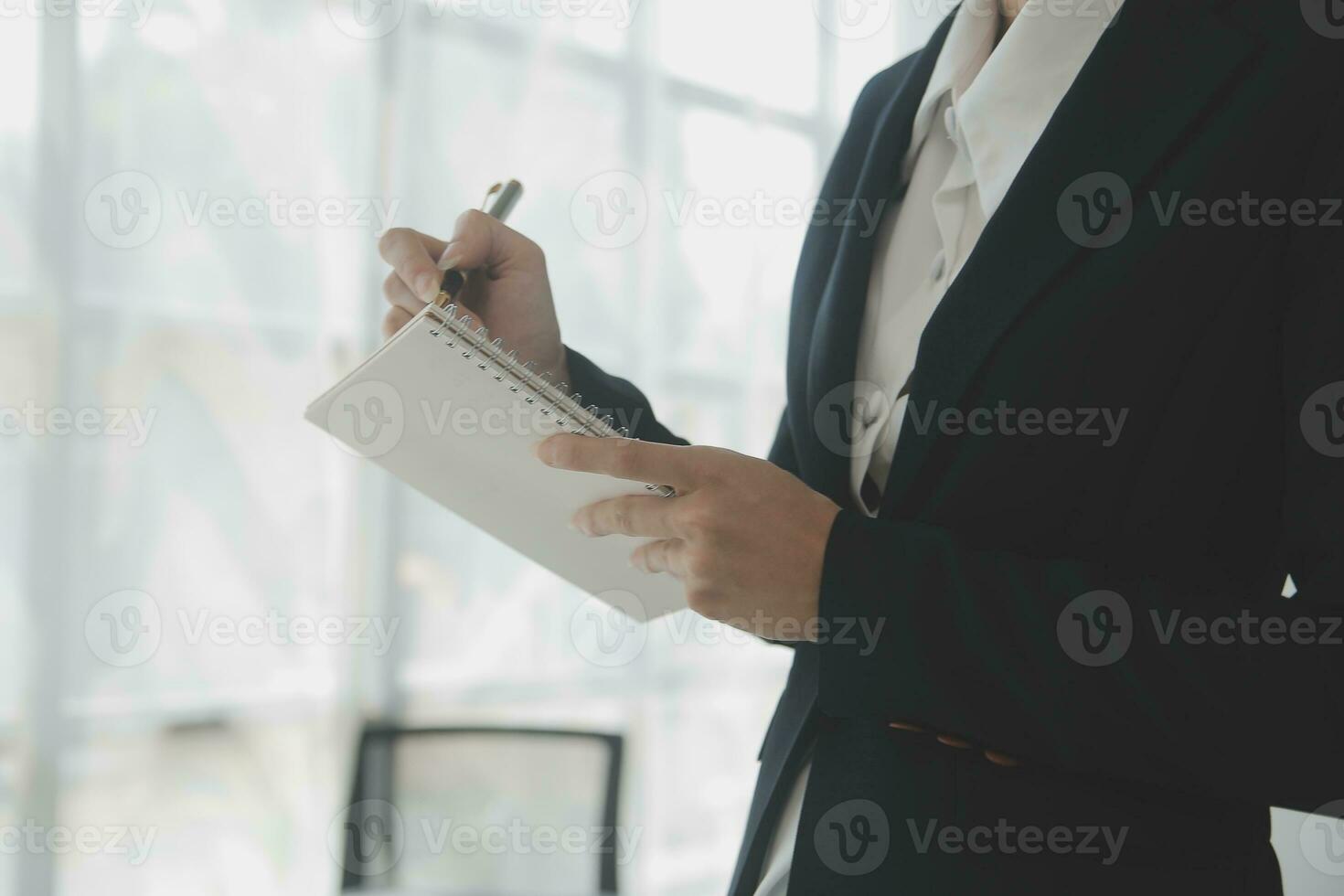 Beautiful female call center operator working on computer in office photo