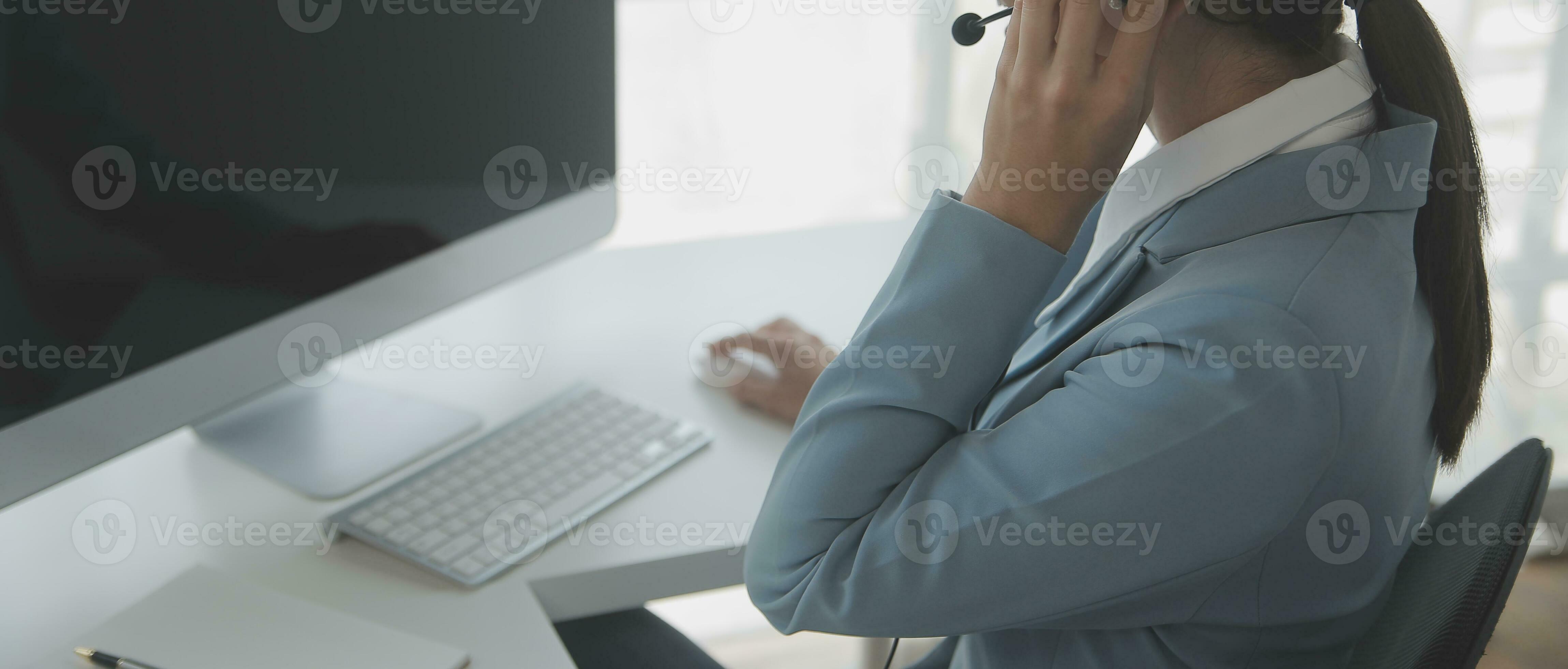 Beautiful female call center operator working on computer in office ...