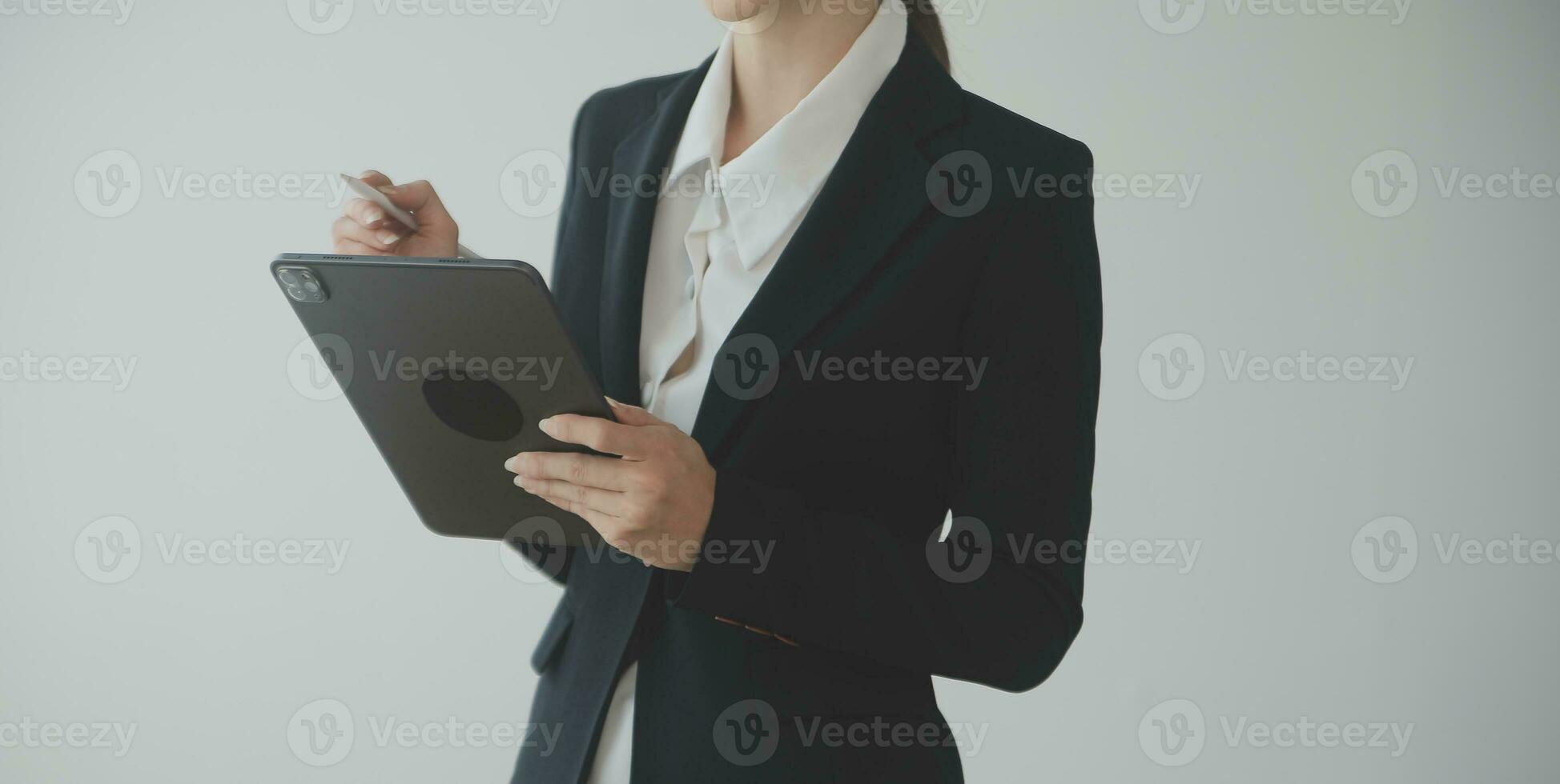 Beautiful female call center operator working on computer in office photo