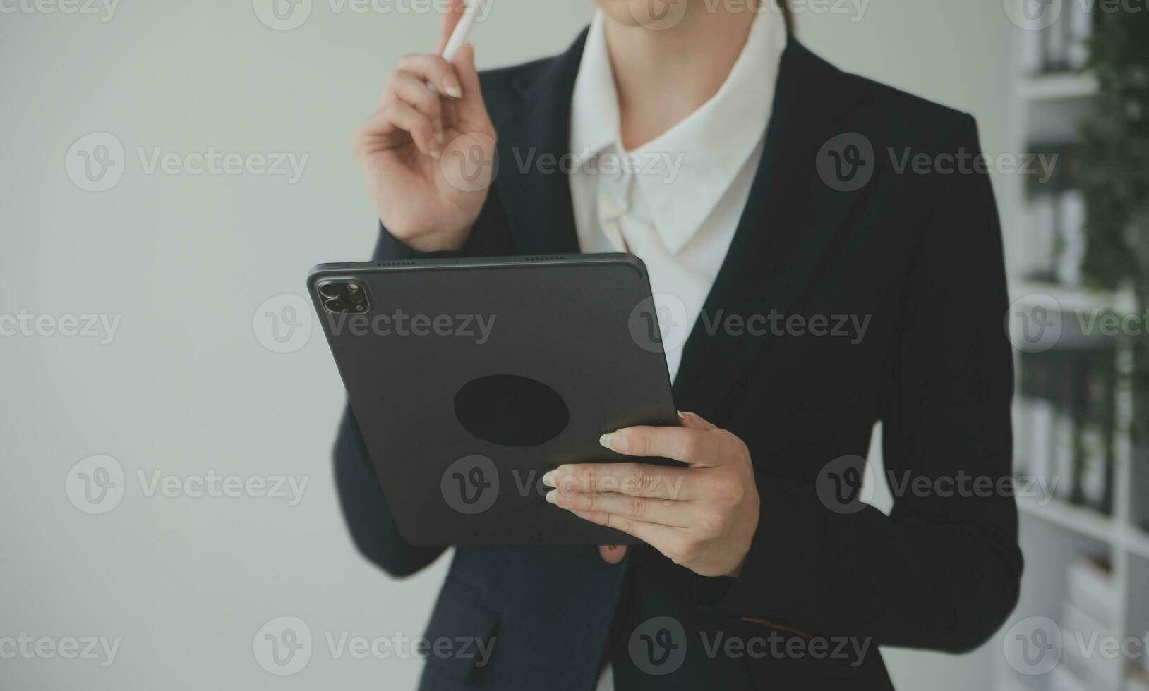 Beautiful female call center operator working on computer in office photo