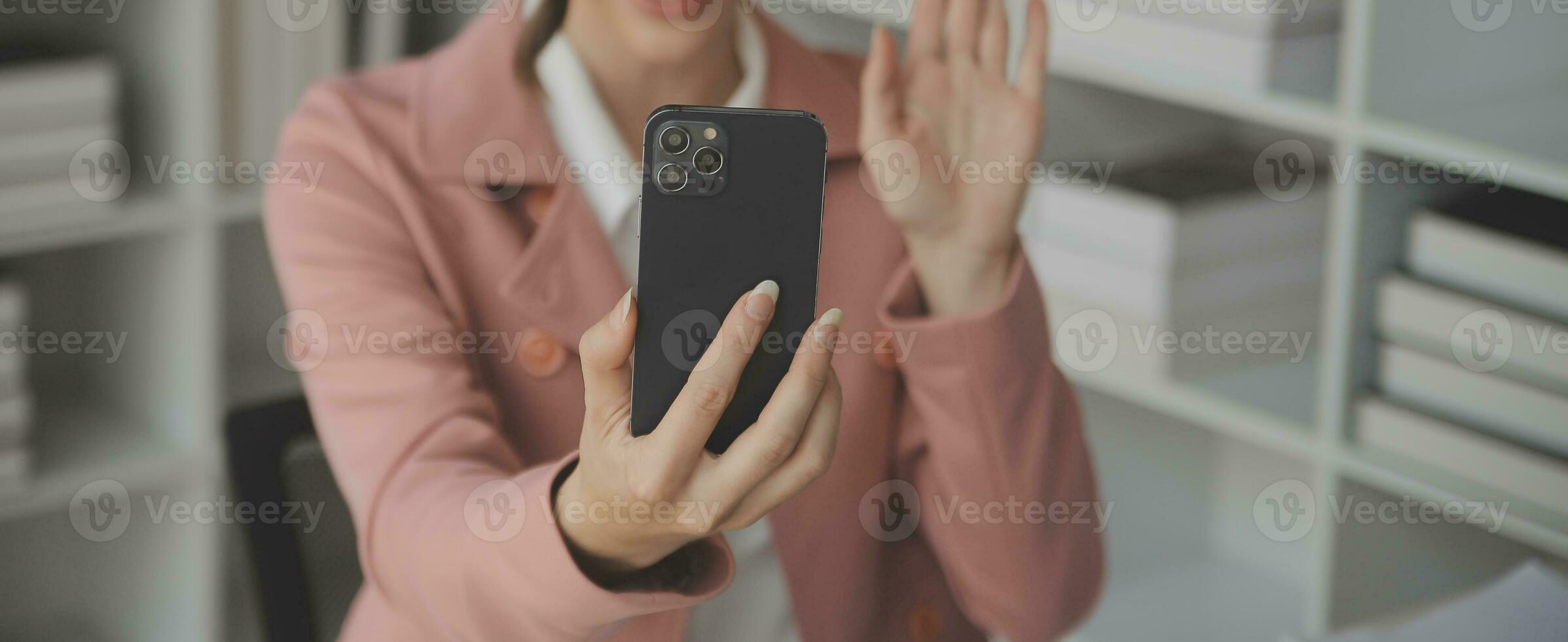 Beautiful female call center operator working on computer in office photo