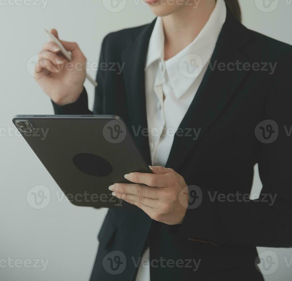 Beautiful female call center operator working on computer in office photo