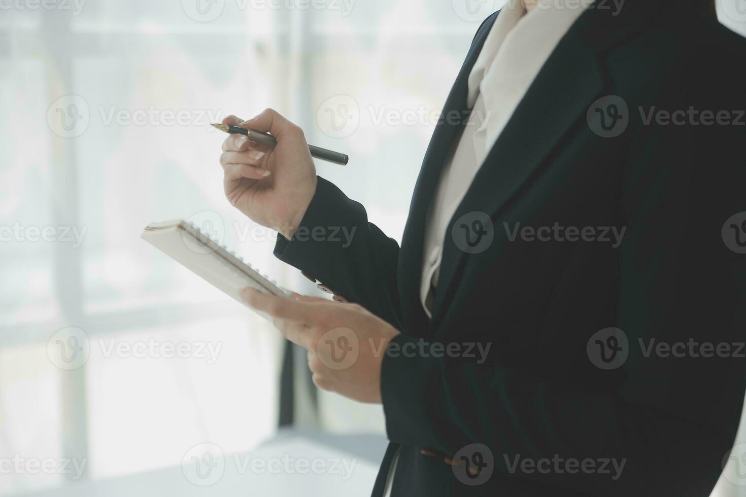 Beautiful female call center operator working on computer in office photo