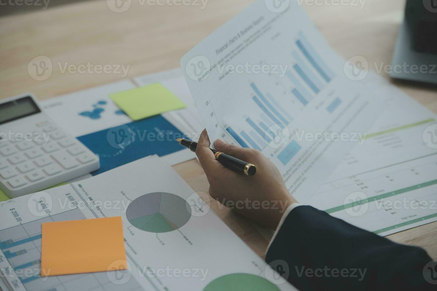 Portrait of Young Asian woman hand freelancer is working her job on computer tablet in modern office. Doing accounting analysis report real estate investment data, Financial and tax systems concept. photo