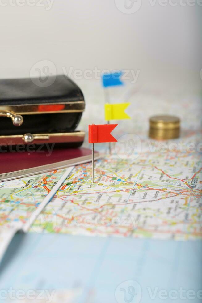 Wallet, coins, pass on a map. photo