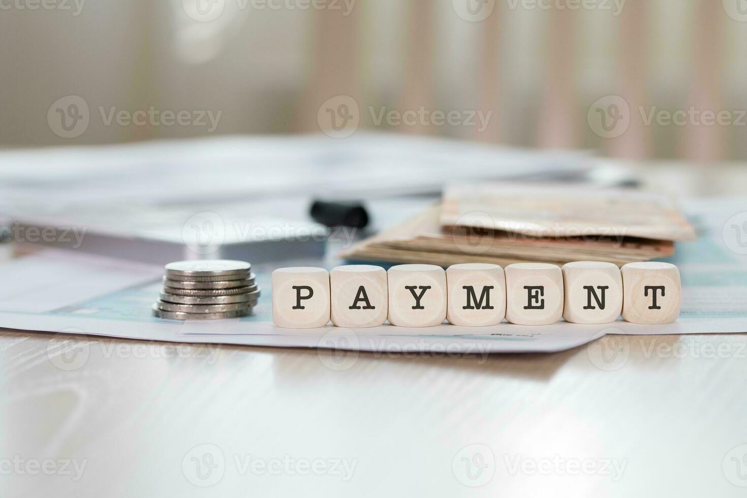 Word PAYMENT composed of wooden letters. photo