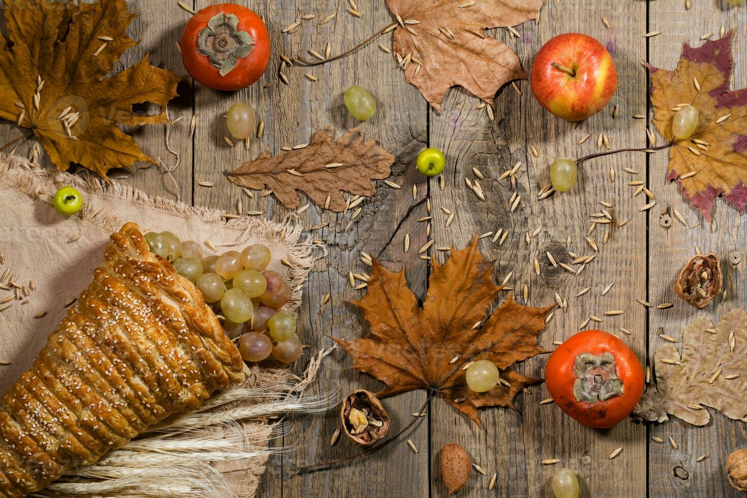 Thanksgiving background cornucopia with fruits on a wooden surface. photo