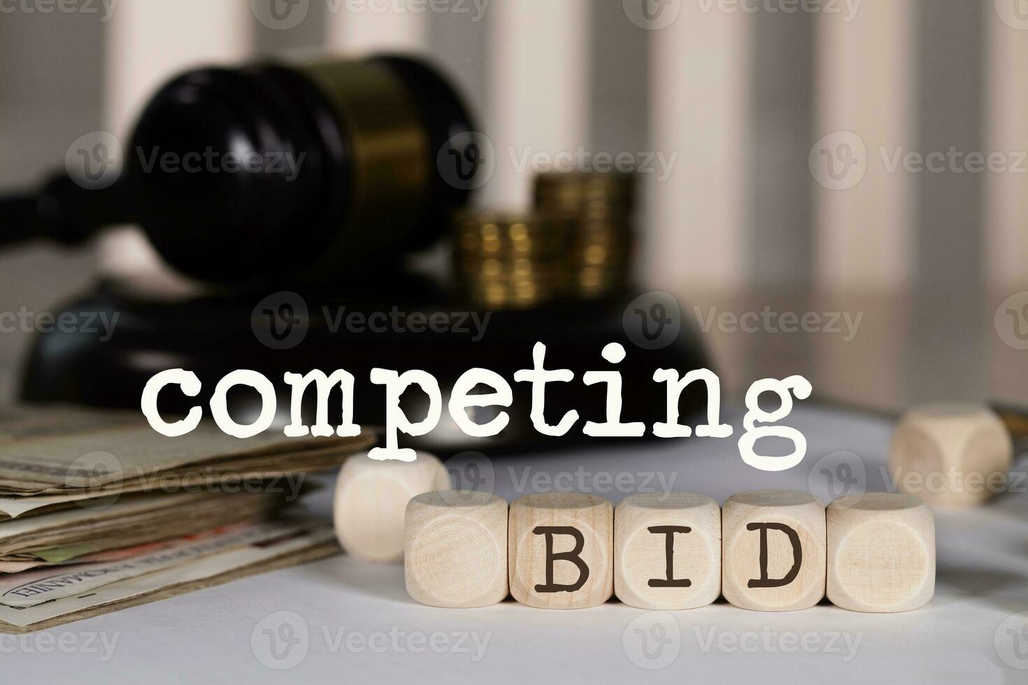 Word COMPETING BID composed of wooden dices. photo