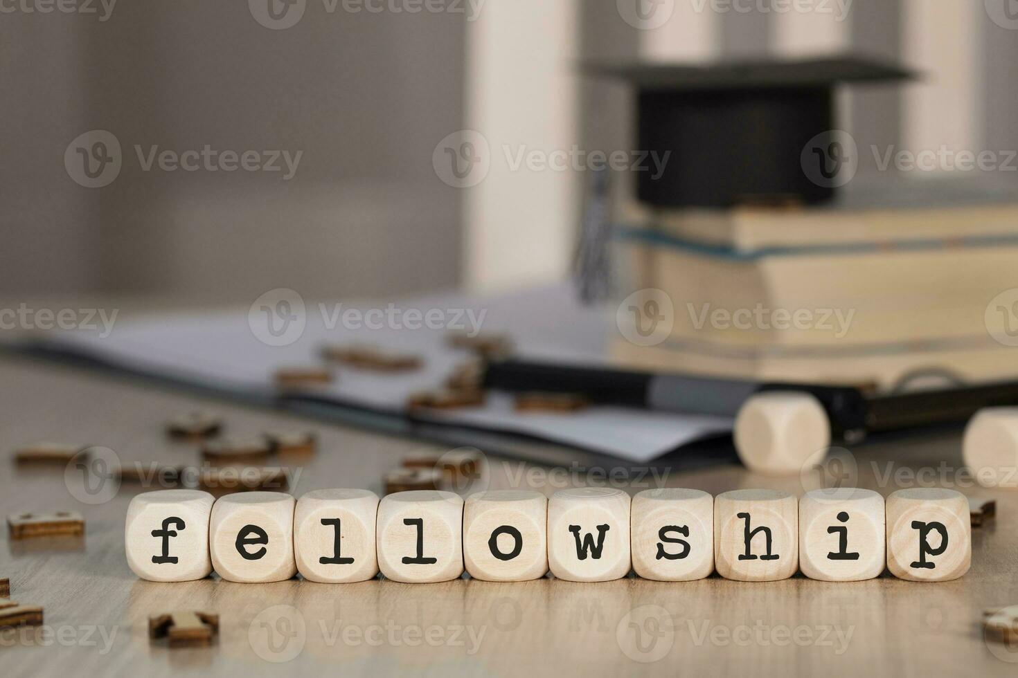 Word FELLOWSHIP composed of wooden dices. photo