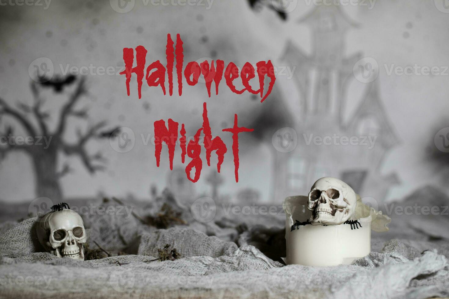 Halloween Night. Skull on an old used thick candle. Scary Halloween background. photo