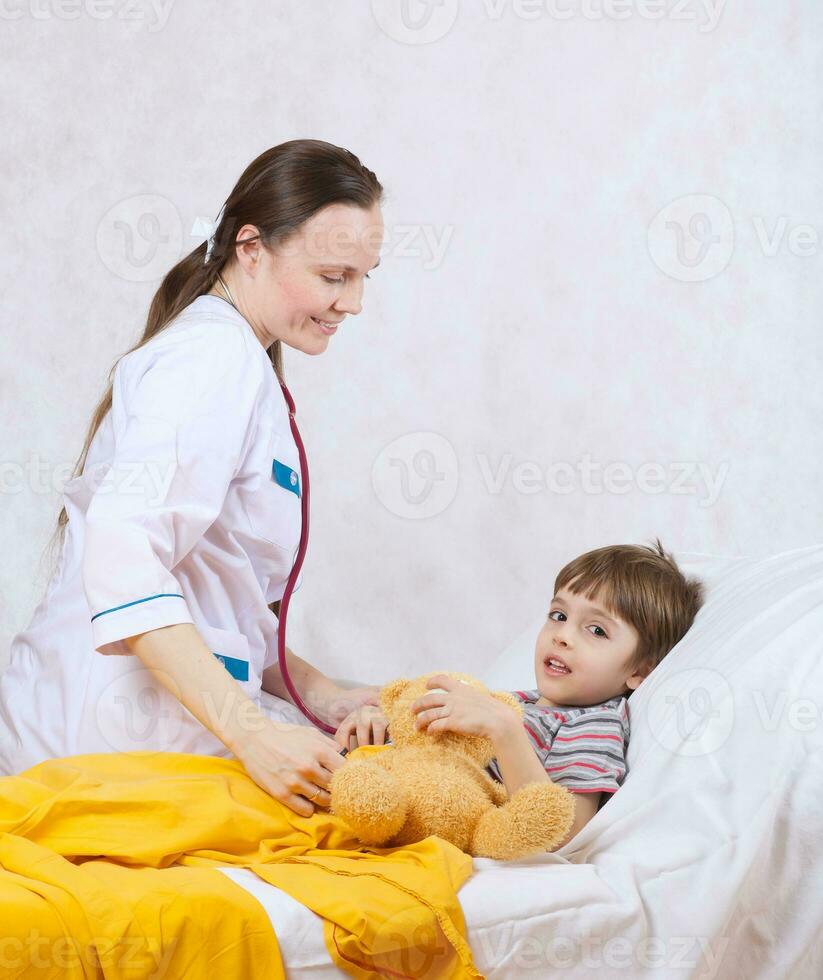 A child and a paediatrician in her cabinet photo