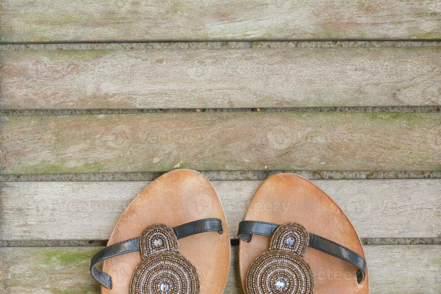 Womens summer shoes on a wooden surface. Background. photo