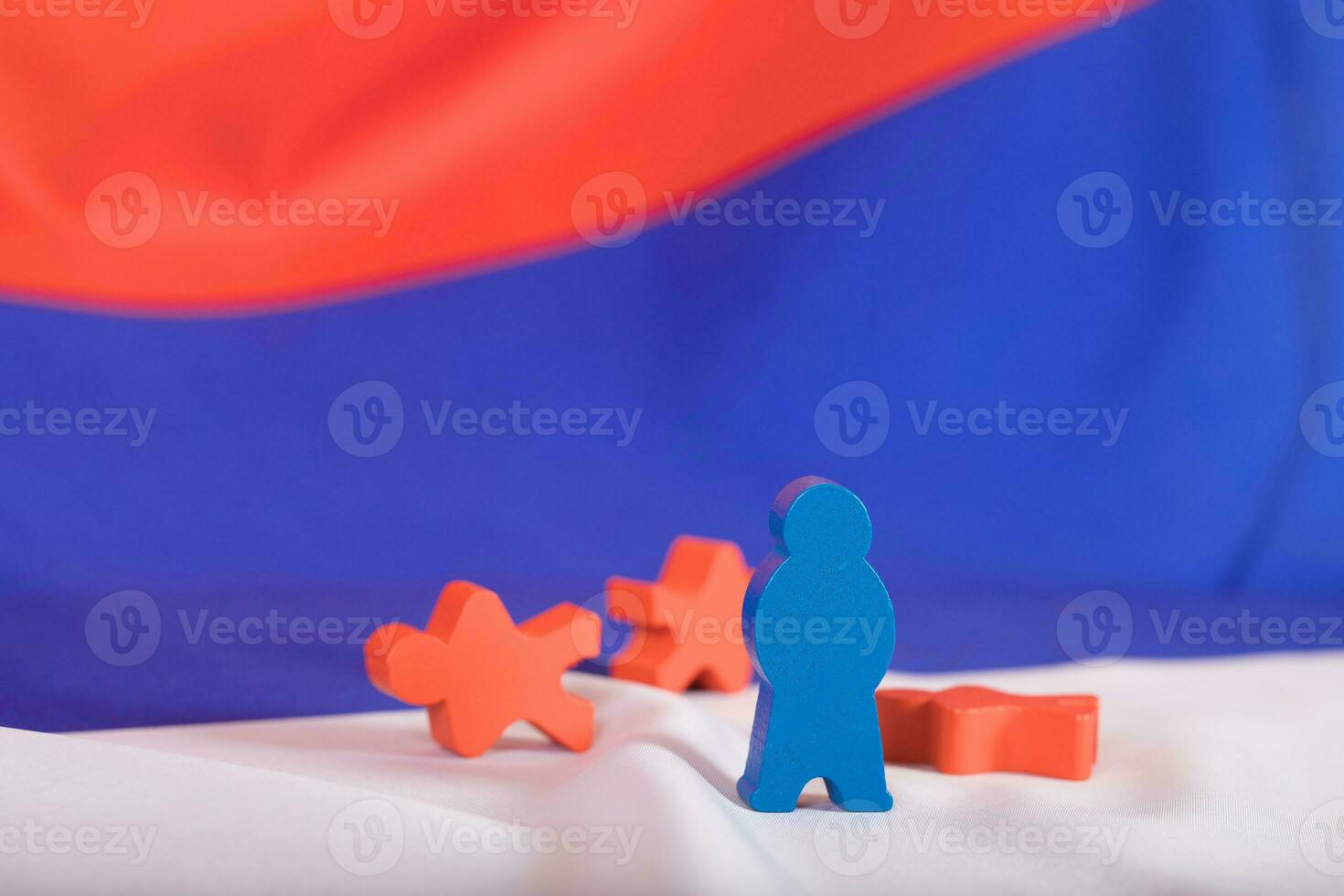 Wooden figures on Russian flag. photo