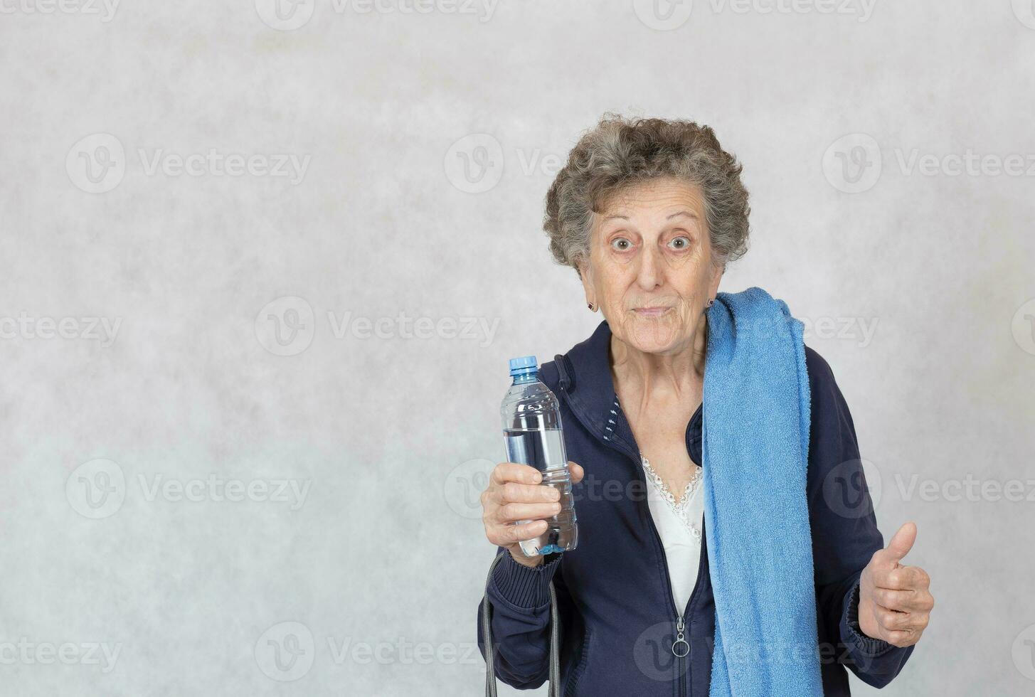 Senior woman is dressed in a sport costume photo