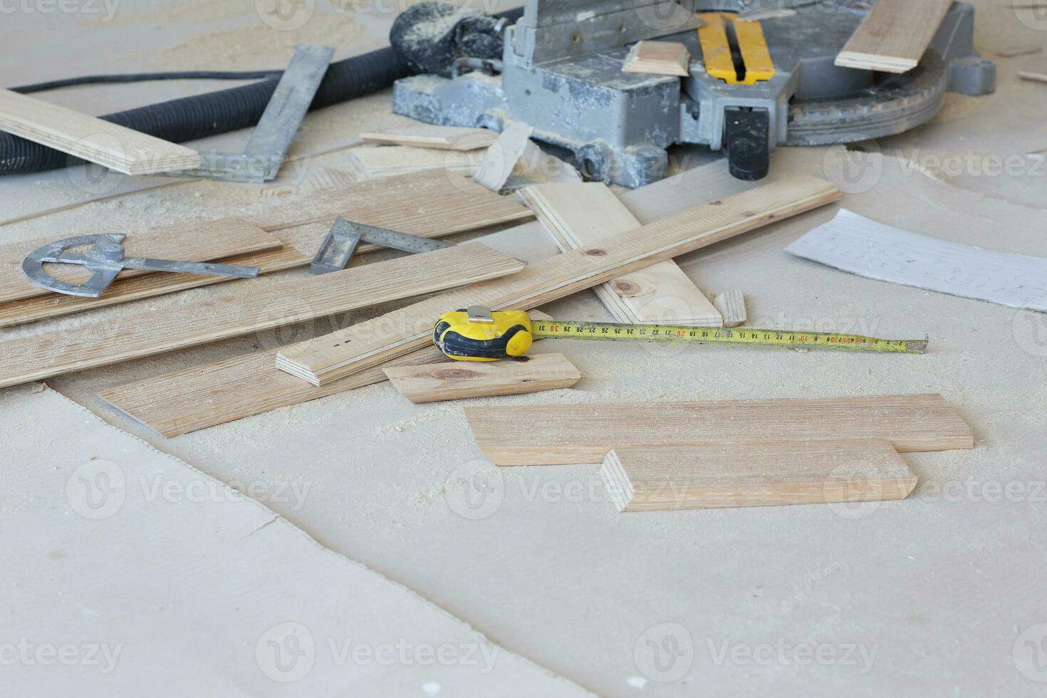 Pieces of wooden plinth placed on a floor. photo