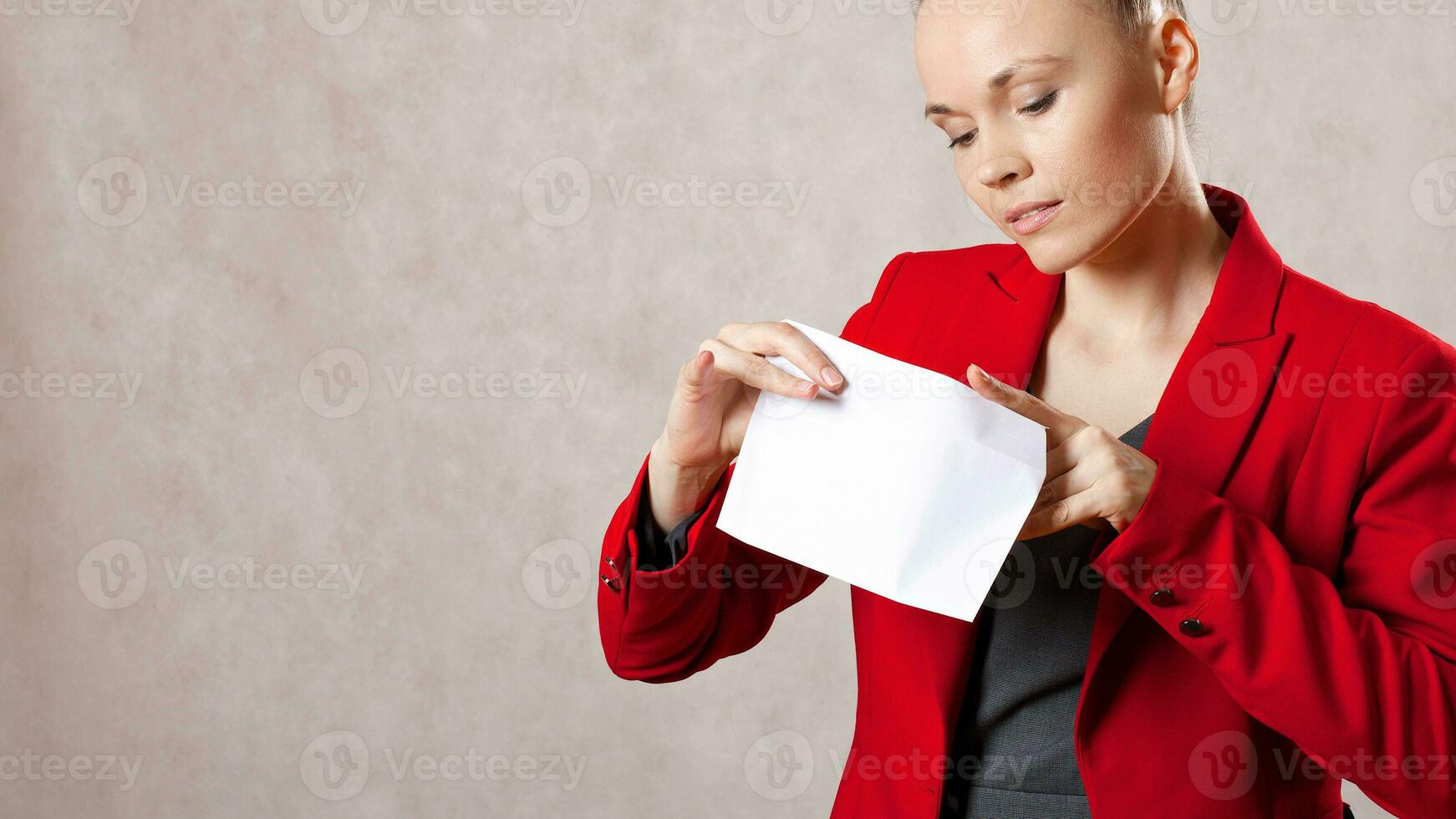 Young caucasian lady  keeps an envelope. Closeup photo