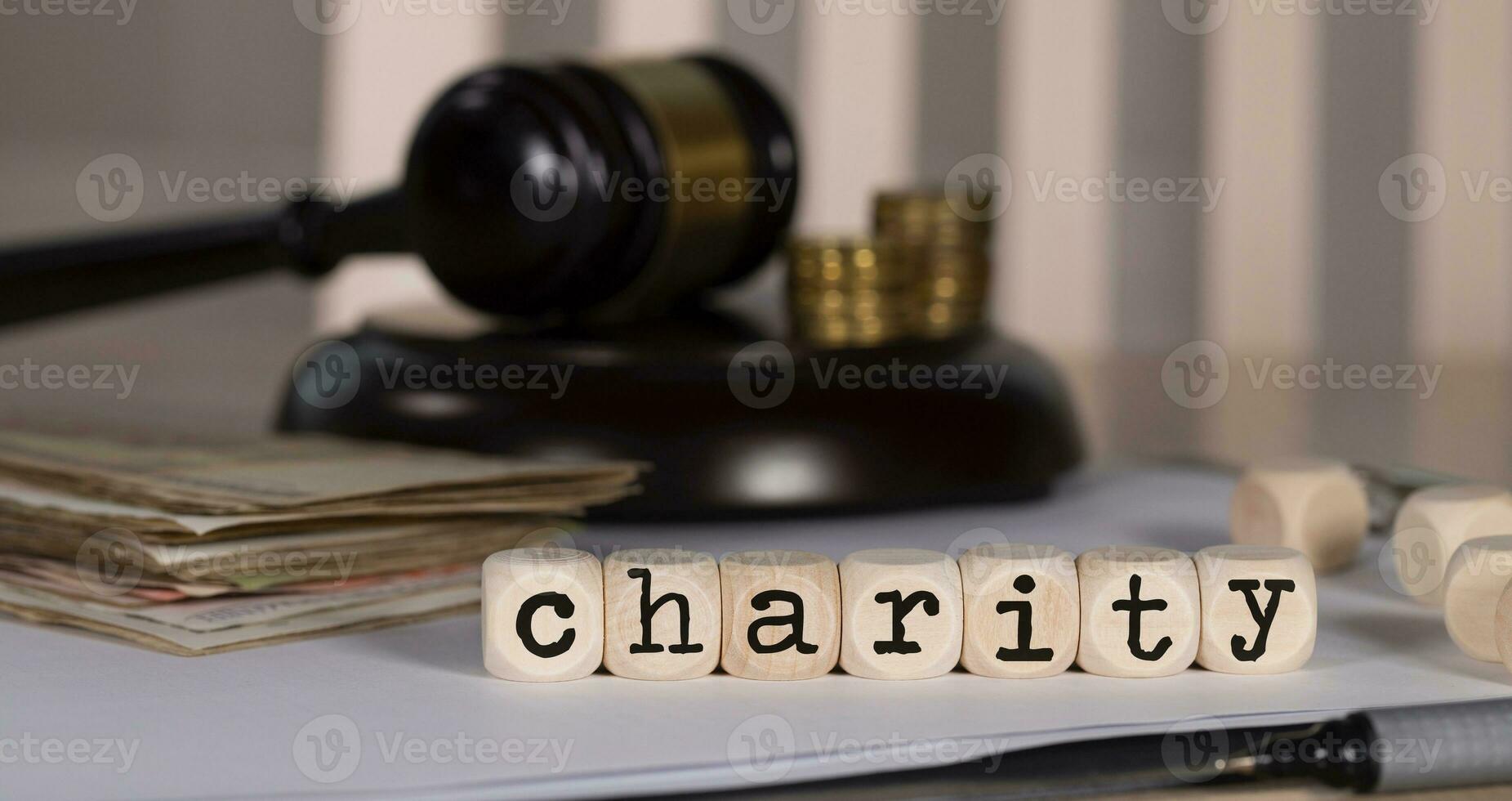 Word CHARITY composed of wooden dices. photo