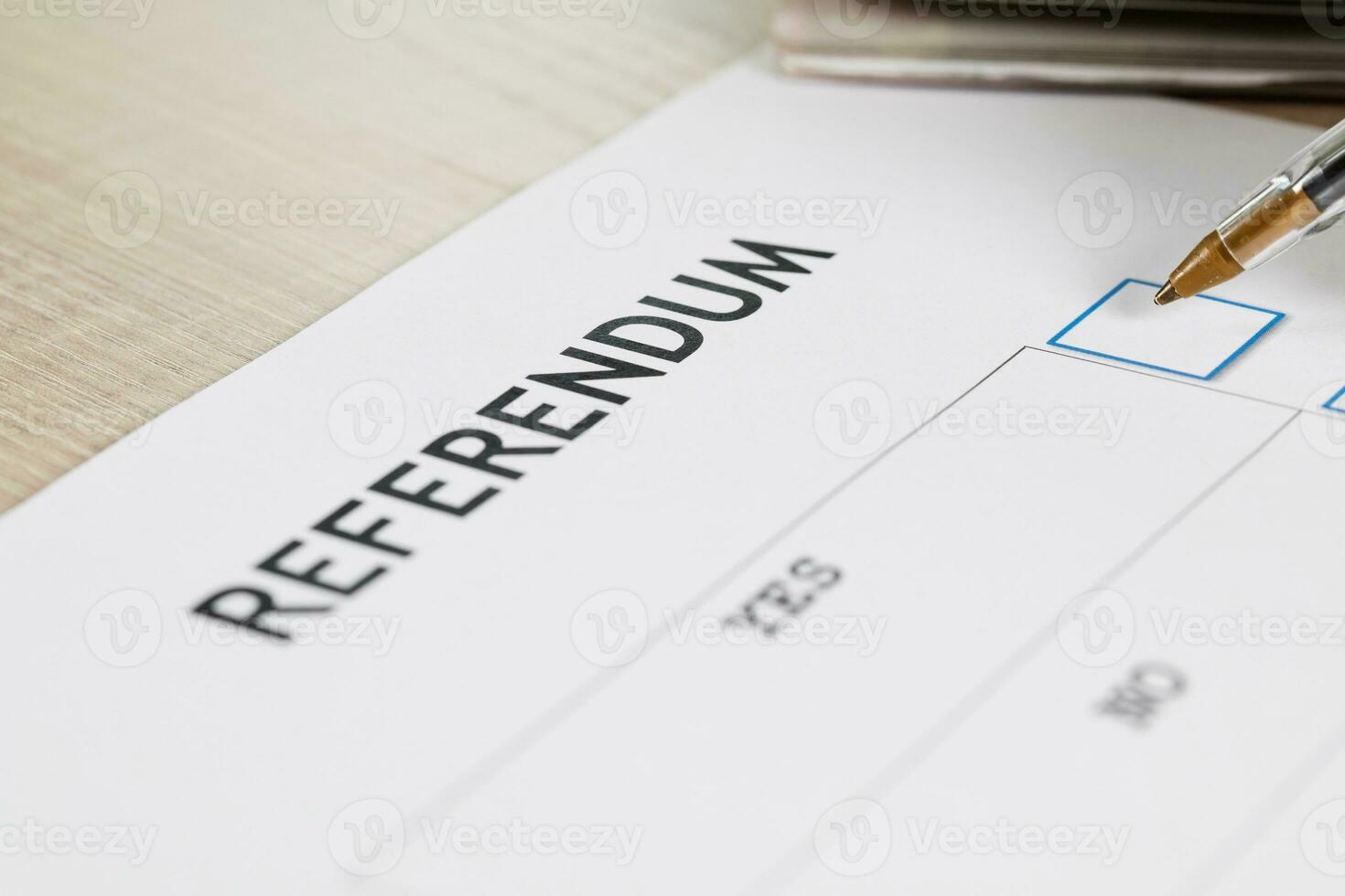 Referendum ballot paper, black pen, and passport on the table. photo