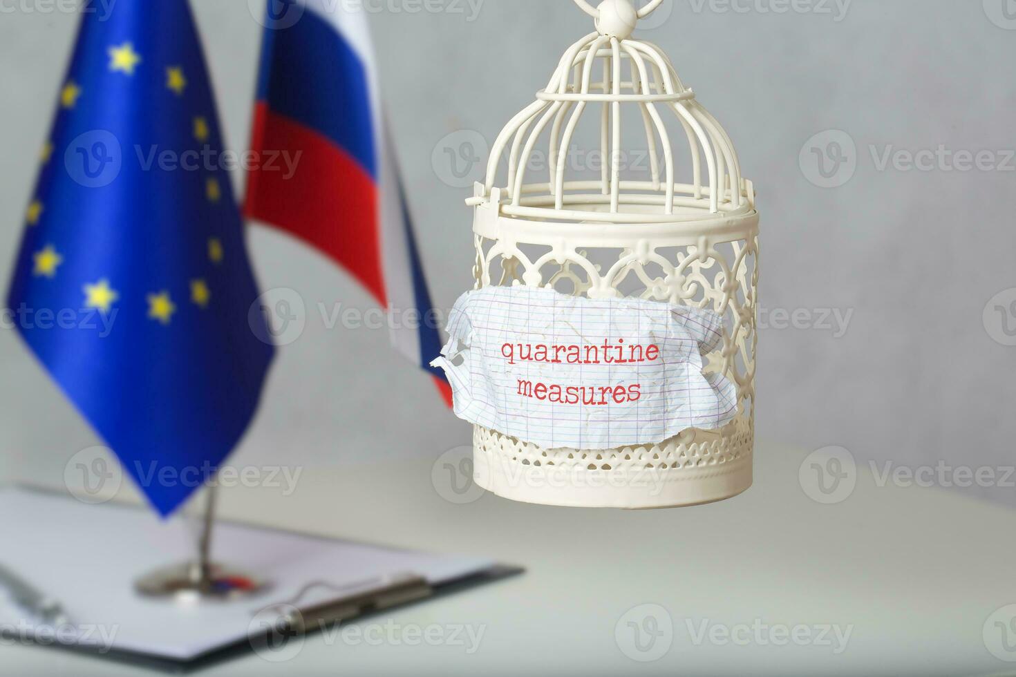 The small cage and the words QUARANTINE MEASURES attached to it. photo