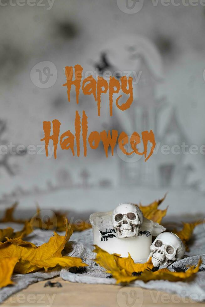 Happy Halloween. Skull on an old used thick candle. Scary Halloween background. photo