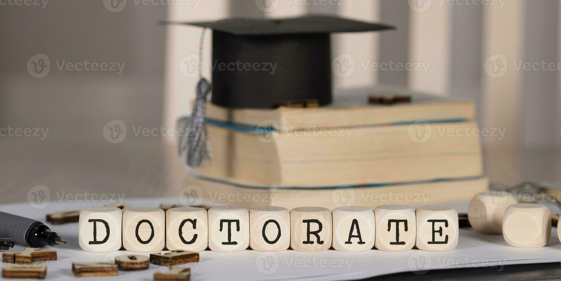 Word DOCTORATE composed of wooden dices. photo
