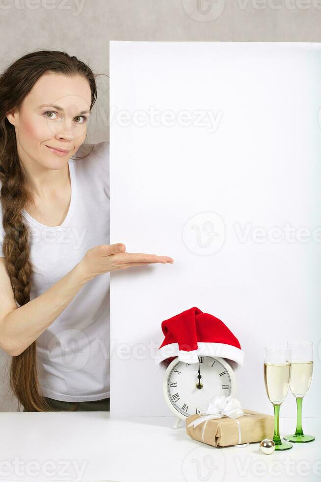 Young lady in Santa Claus hat photo