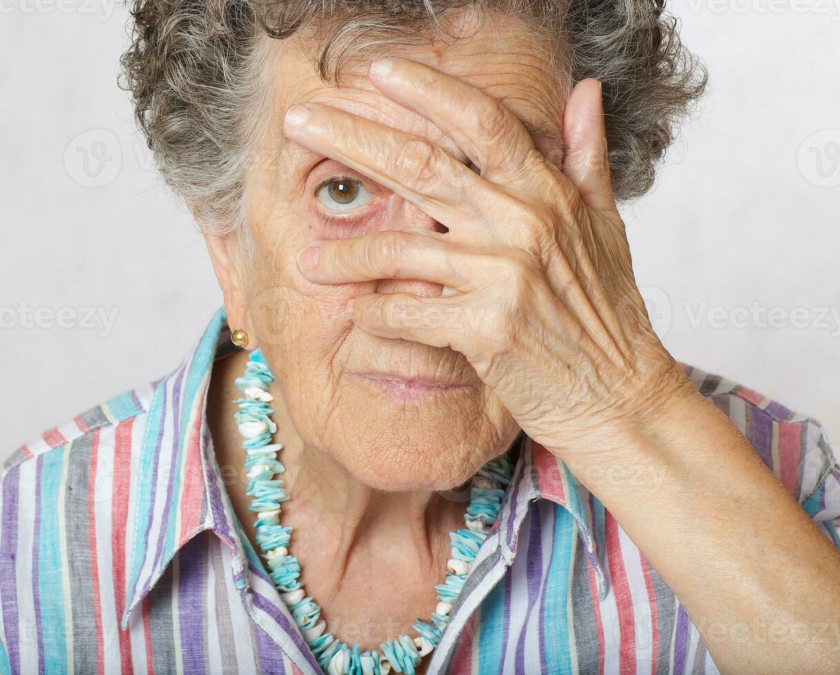 Senior woman show that her right are limited photo