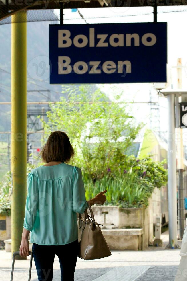 The young woman at a railway station photo