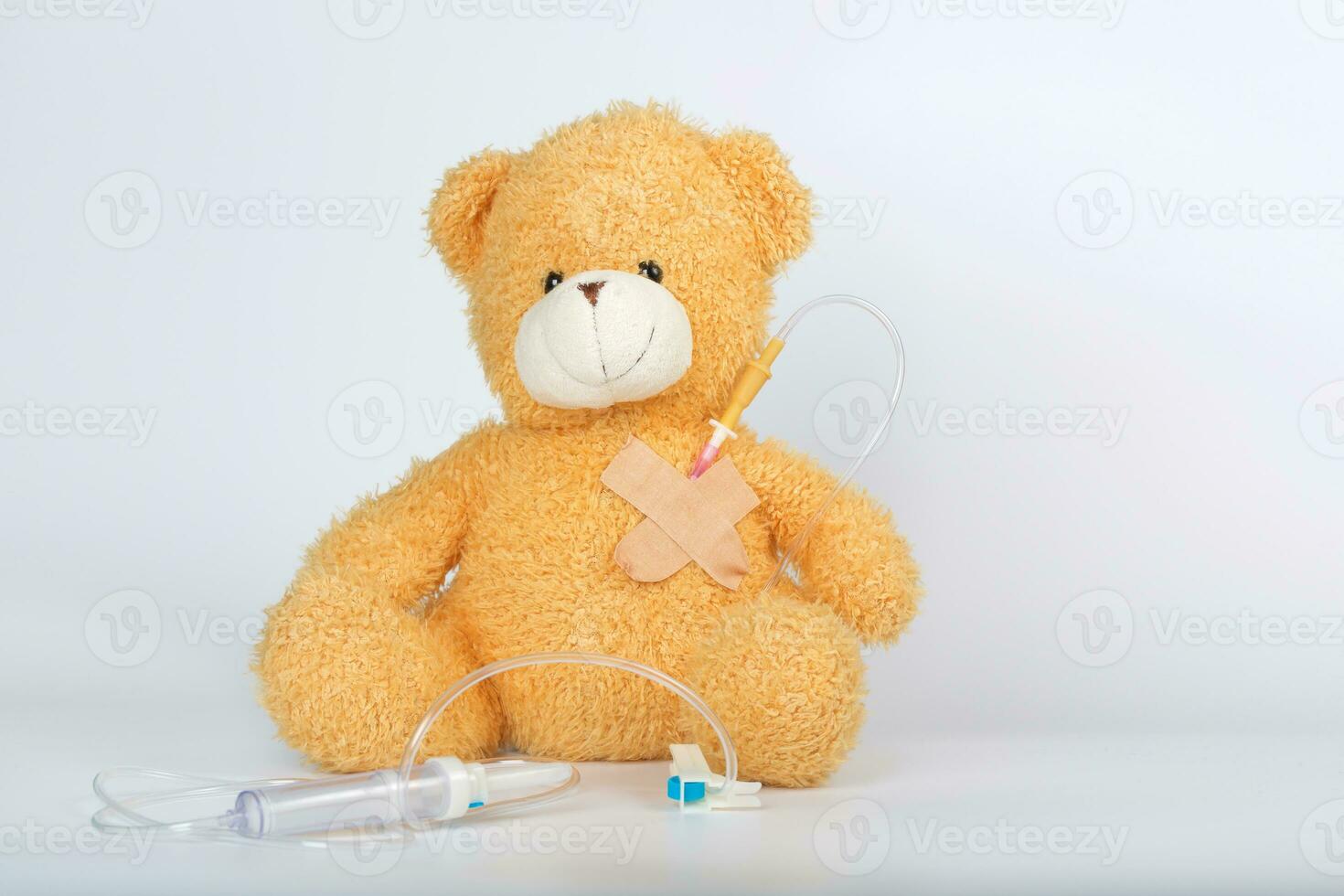 Teddy bear with blood transfusion system. Closeup photo