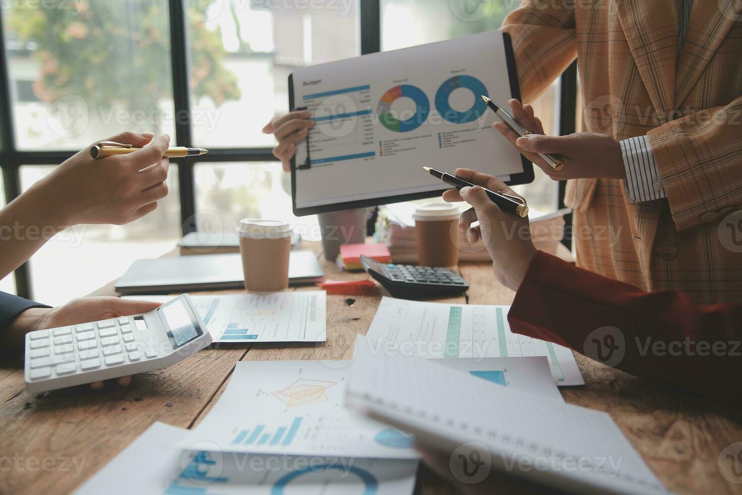 Team of business people are meeting to analyze data for marketing plan,Market research reports and income statistics, Financial and Accounting concept. photo