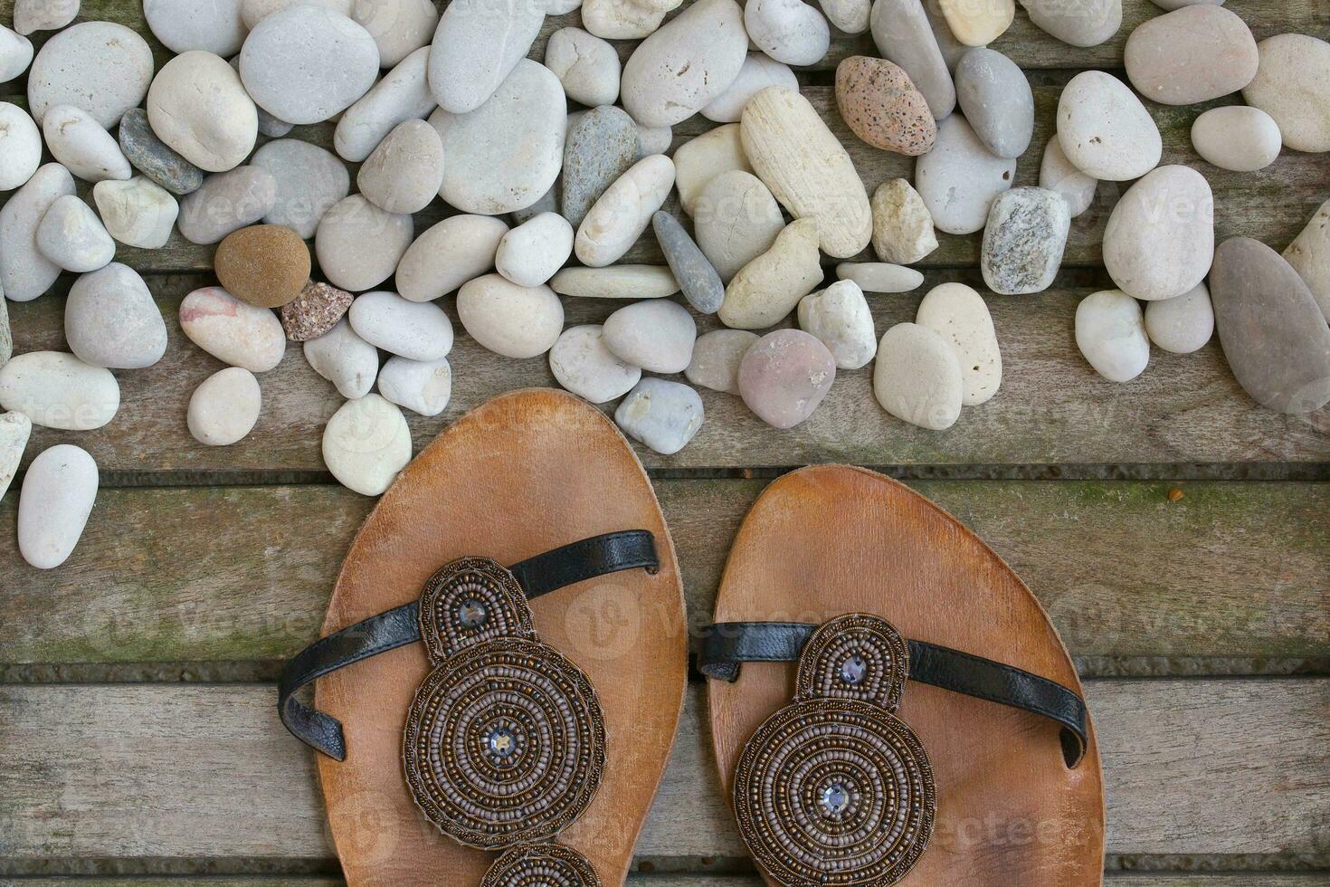 Womens summer shoes on a wooden surface. Background. photo