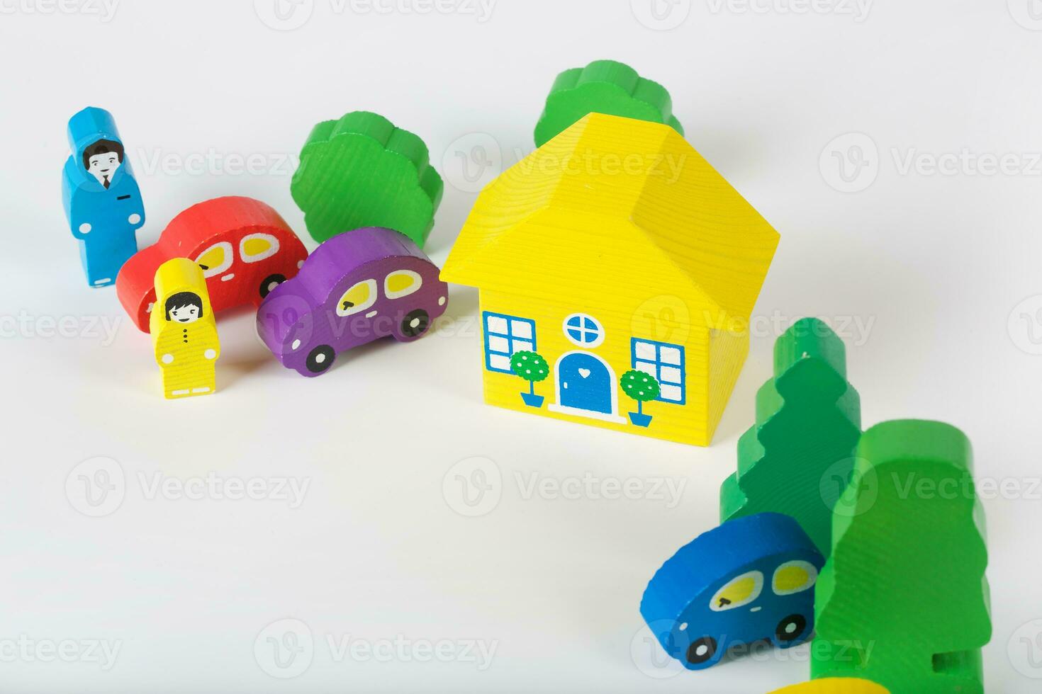 Toy cars, house and trees photo