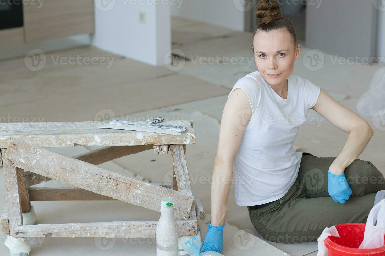 Young lady renovates  apartment photo