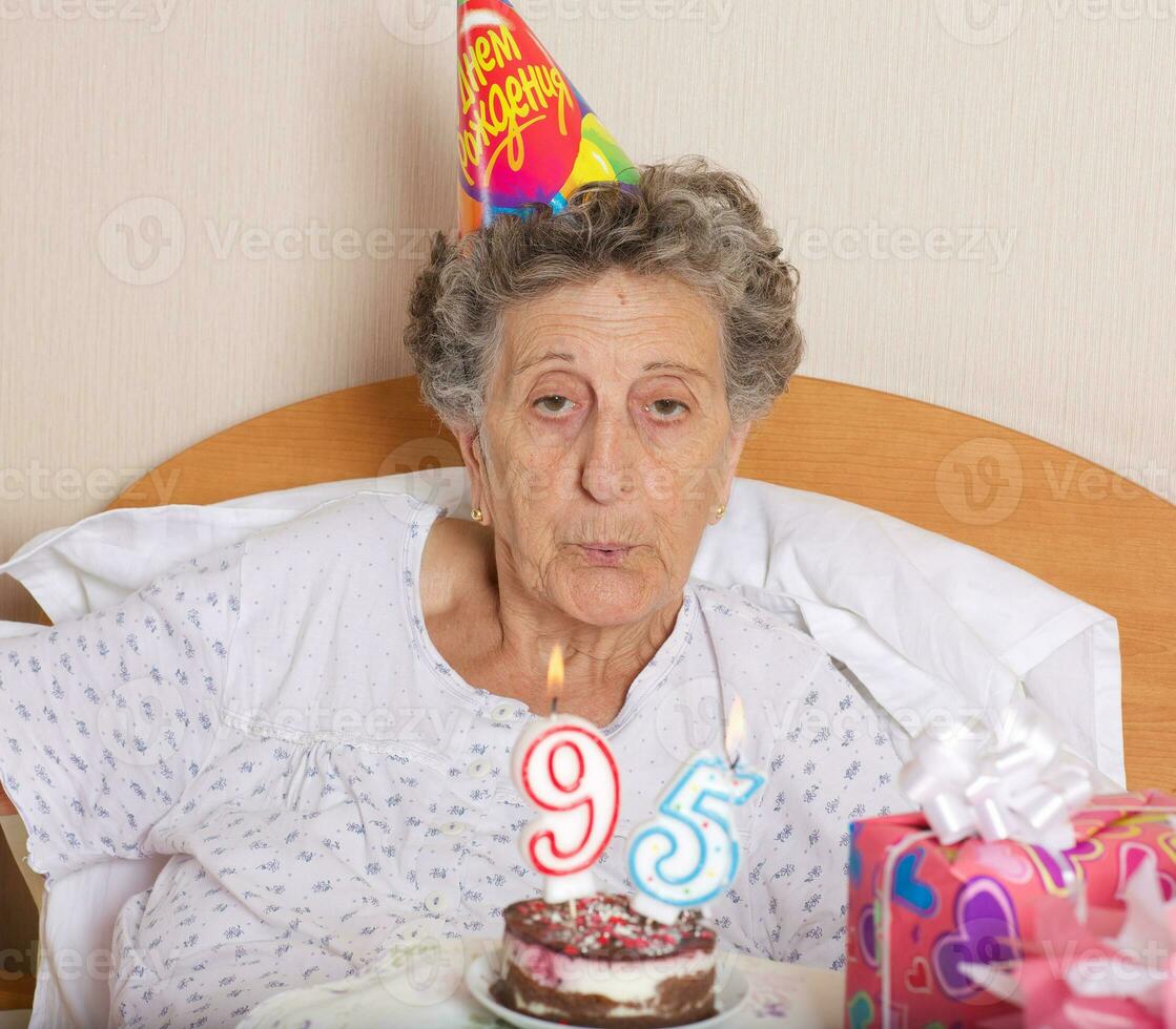 Old woman celebrates her birthday photo