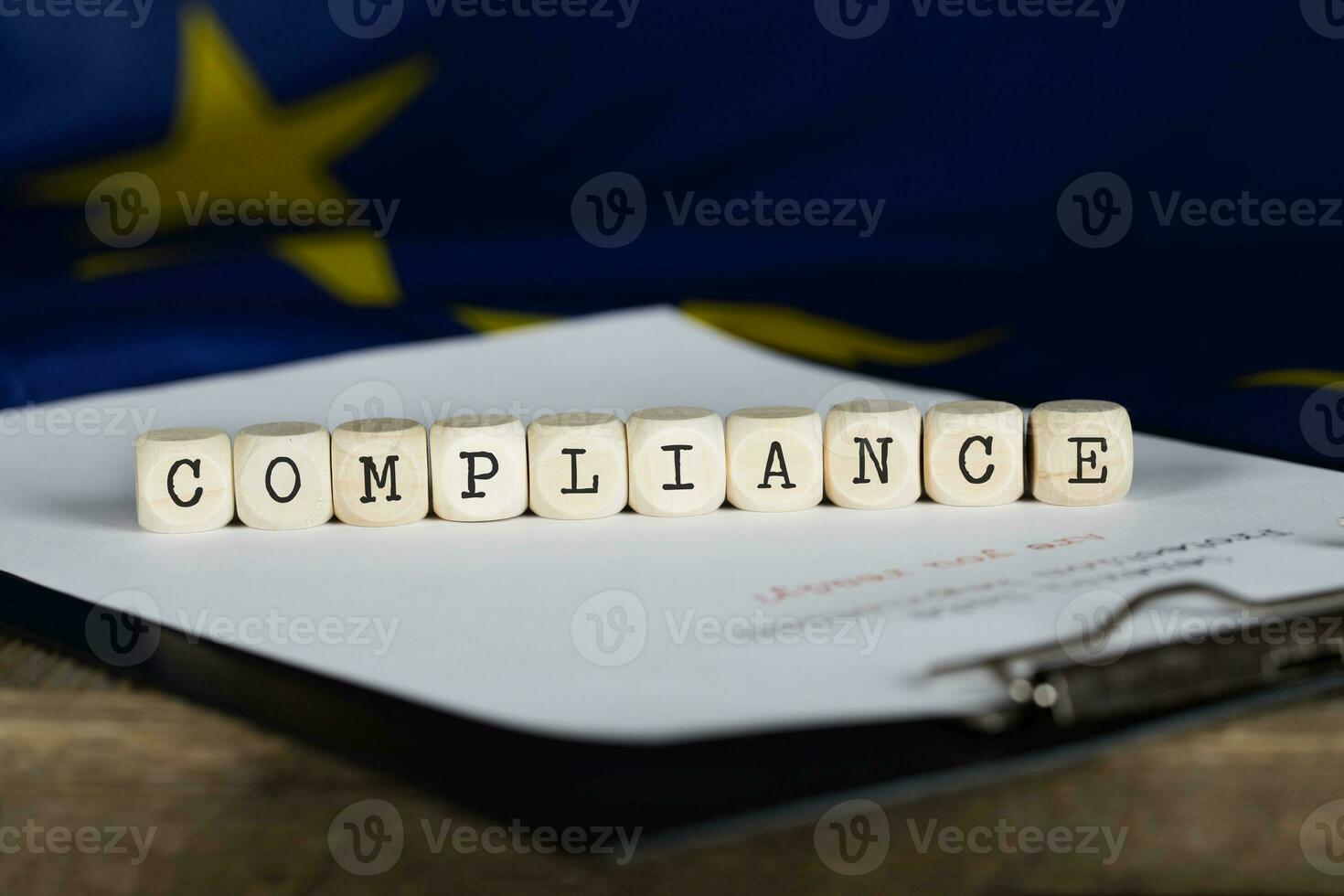 Word COMPLIANCE composed of wooden dices. photo