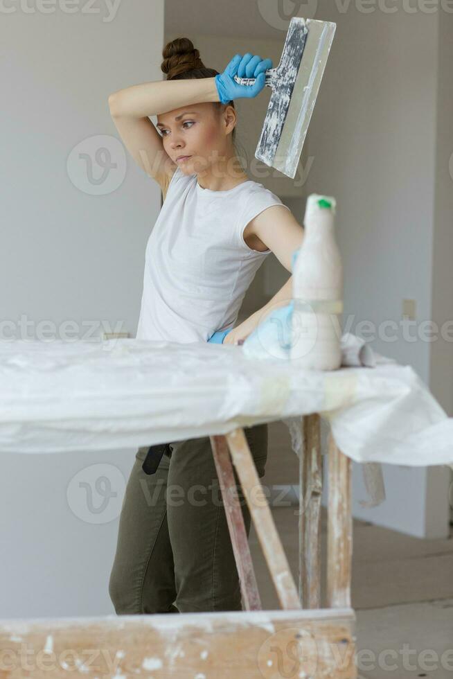 Young lady renovates  apartment photo