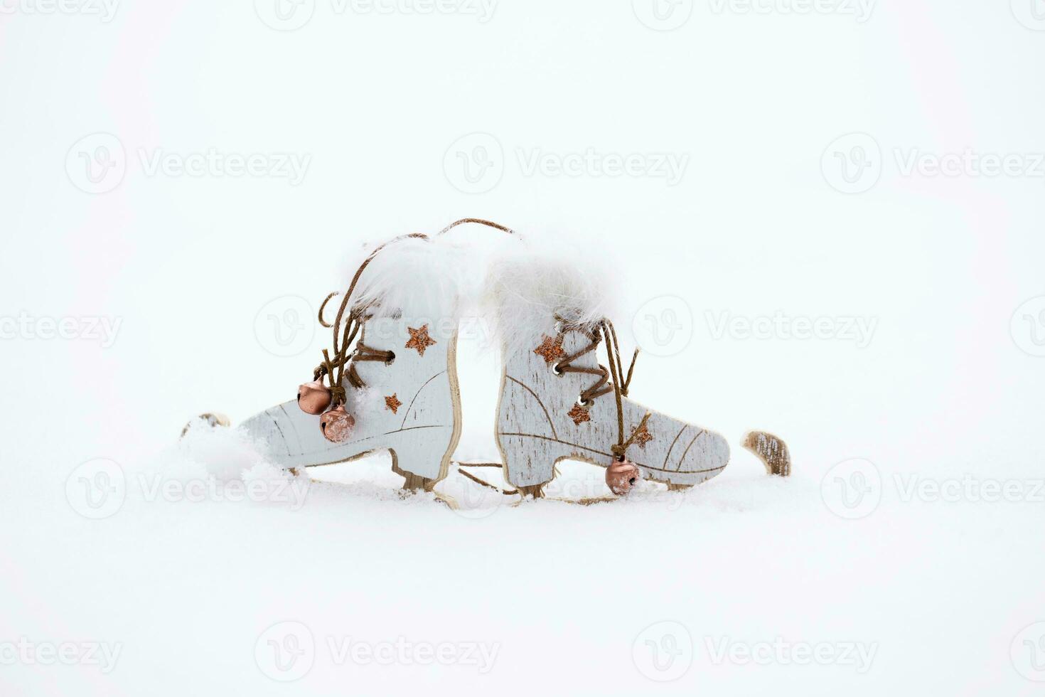 Wooden made skates in the snow. Closeup photo