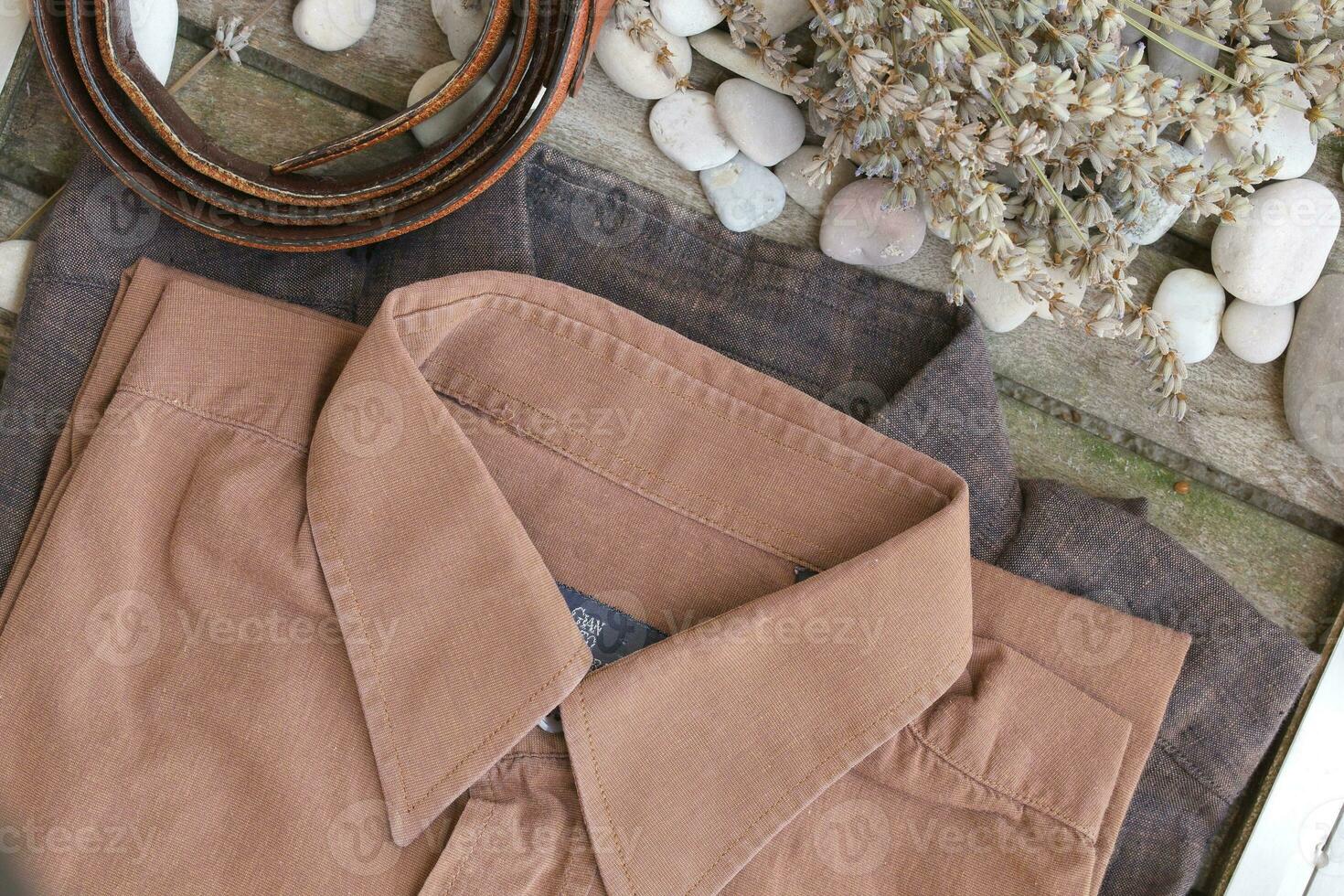 Male summer shirt on an wooden surface. Background photo