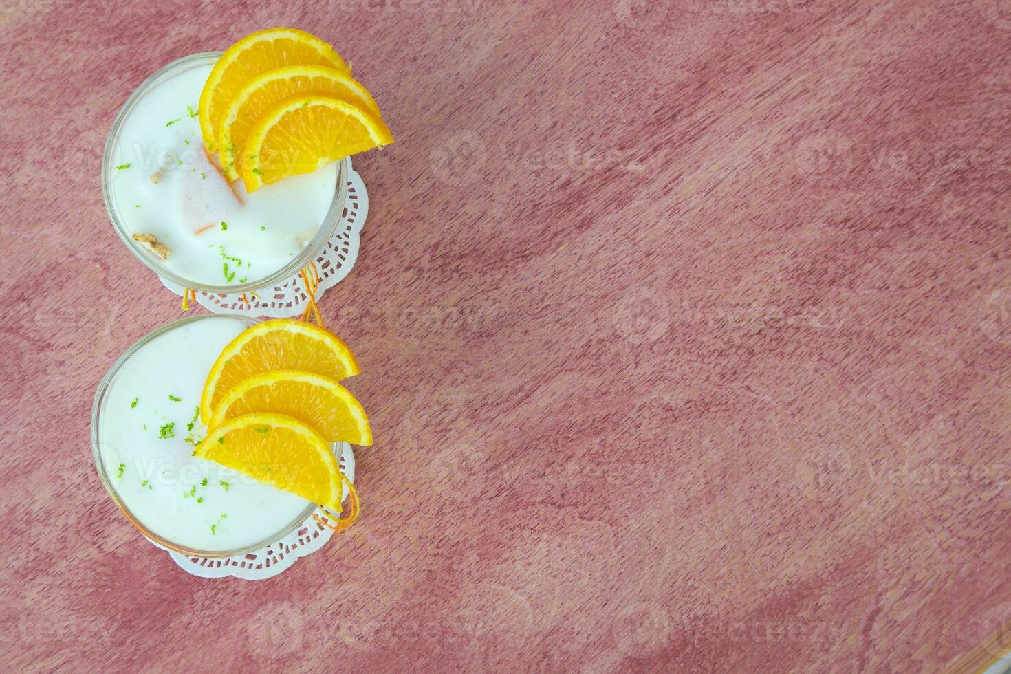 Milk dessert with orange photo