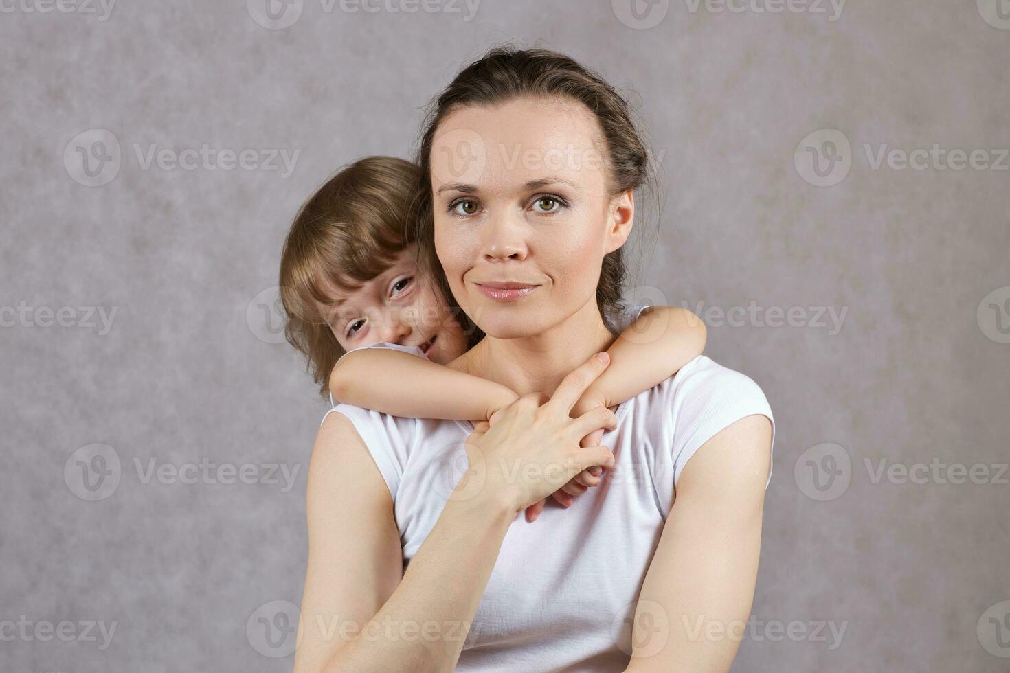 Young mother with her 3 years old son. photo