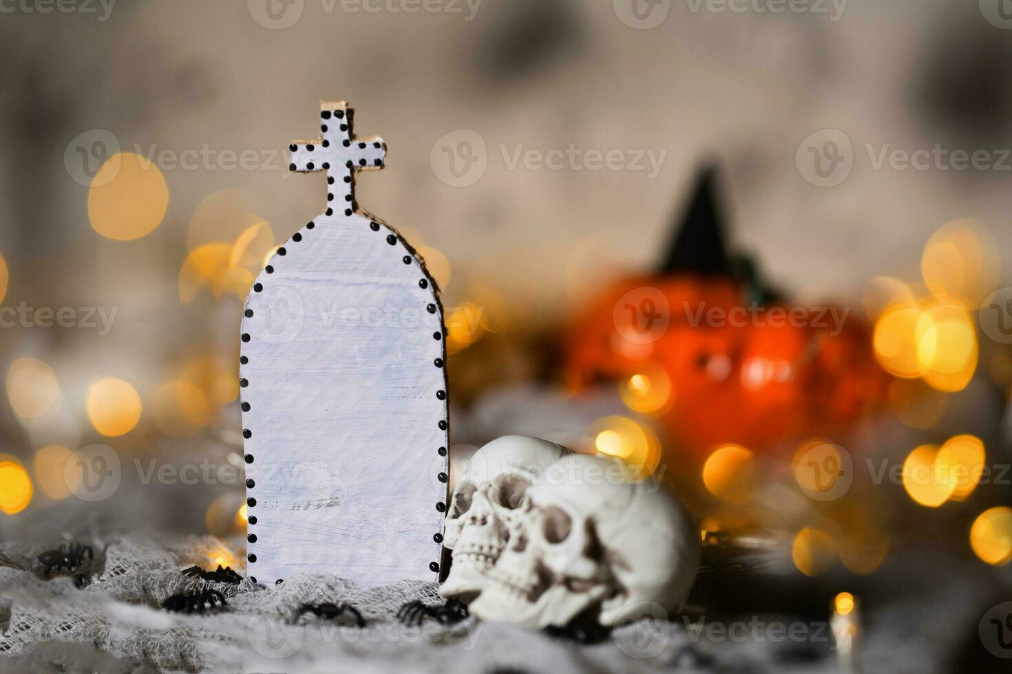 Grave and two skulls. Free space for a text.Closeup photo