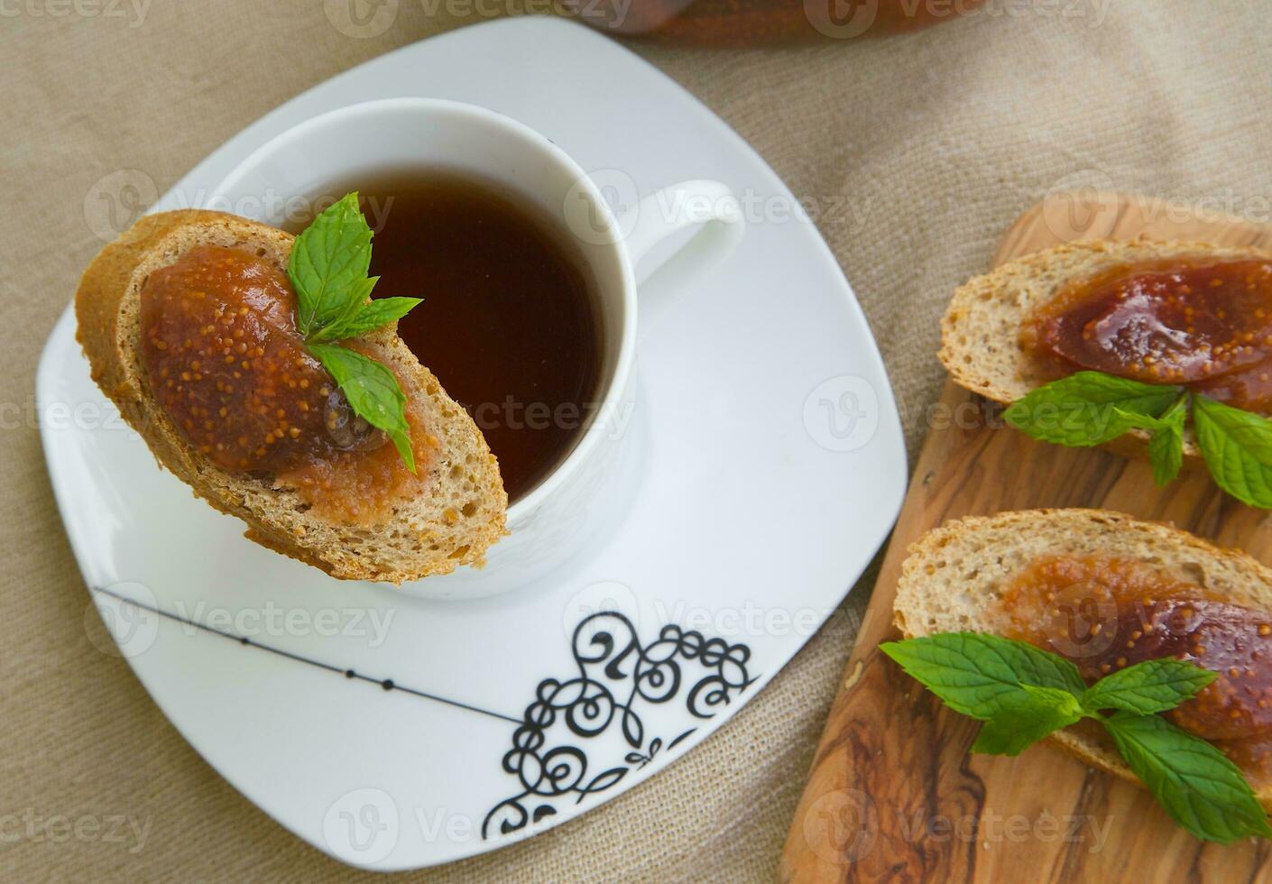 A piece of bread with violet fig marmalade photo