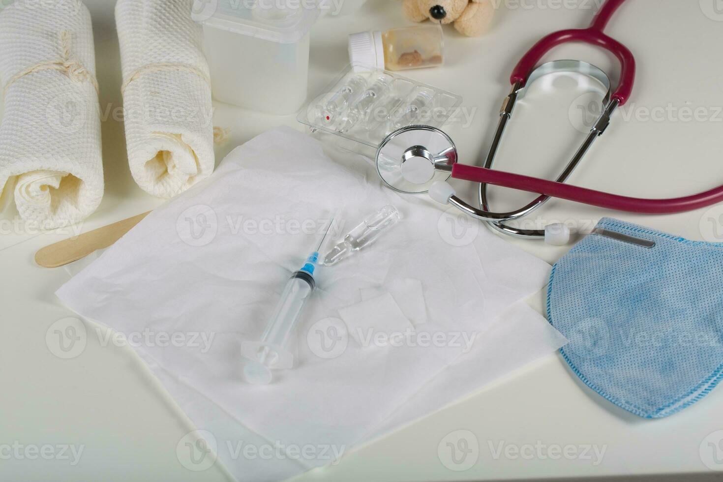 Syringe and vaccine on a white table. Closeup photo