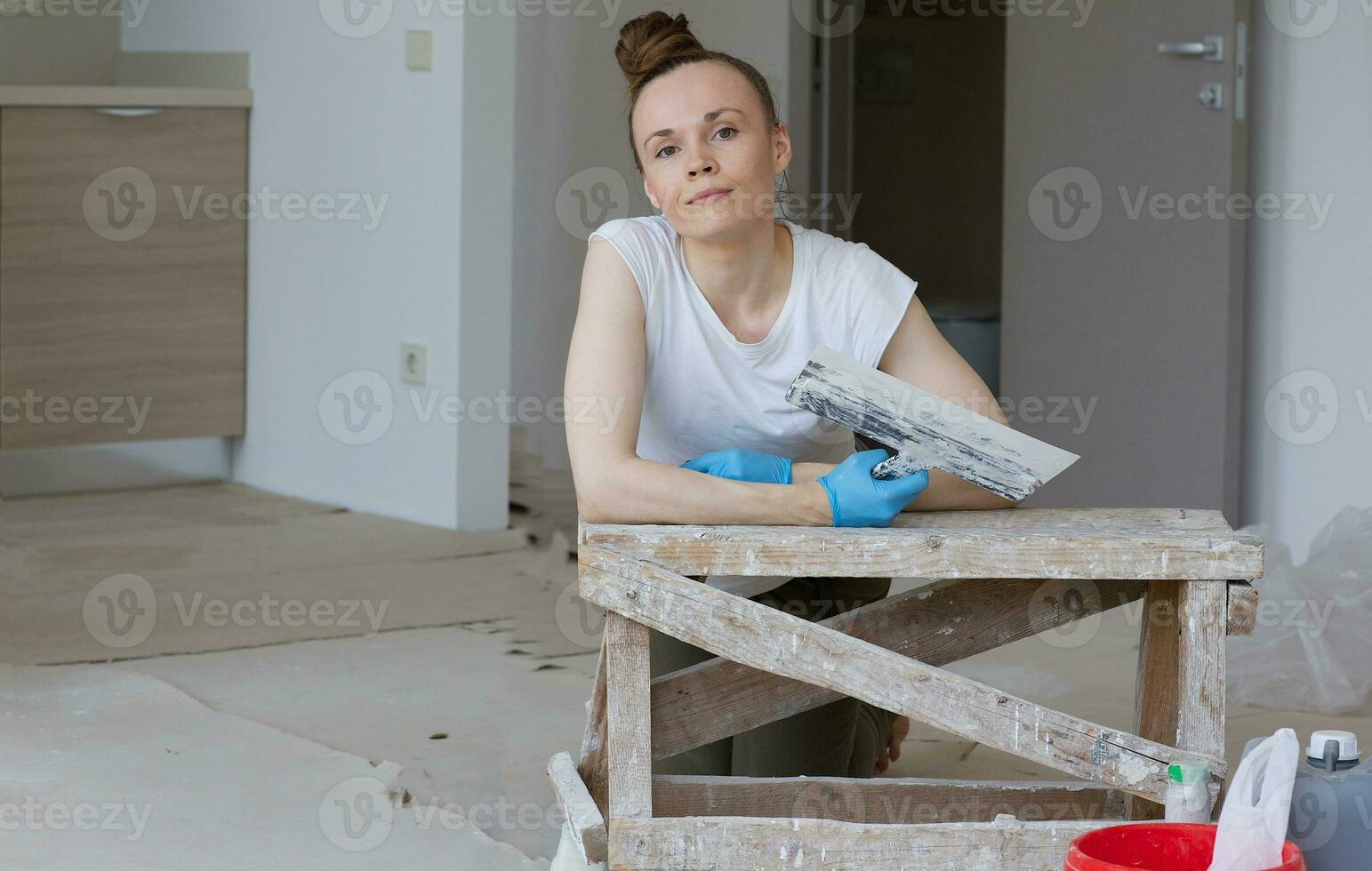 Young lady renovates  apartment photo