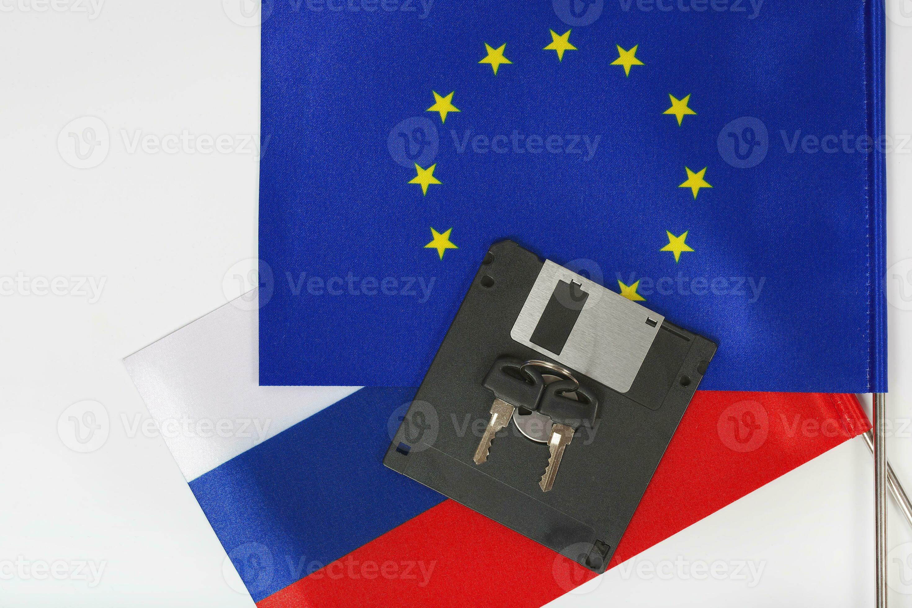 Floppy disk,keys,two flags on a white surface 24989304 Stock Photo at