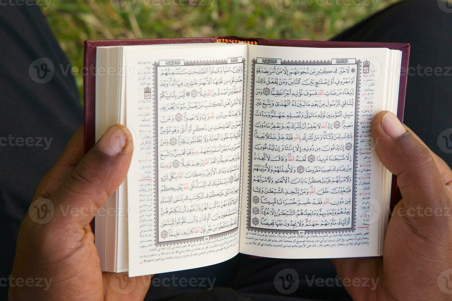 The man is reading the Koran photo
