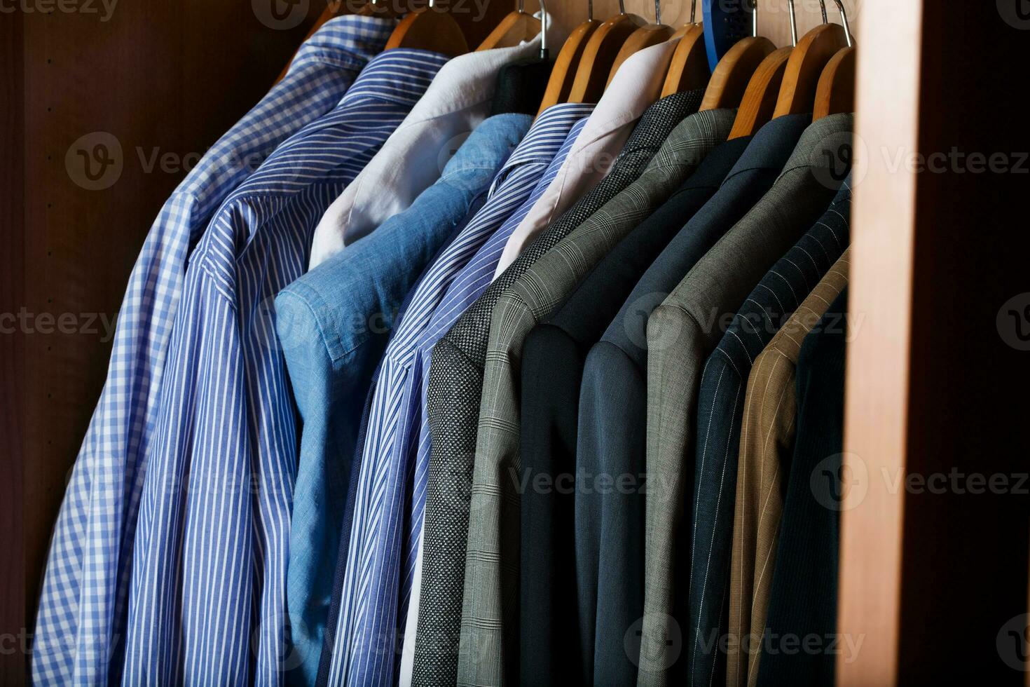 Open wardrobe of a business man. photo