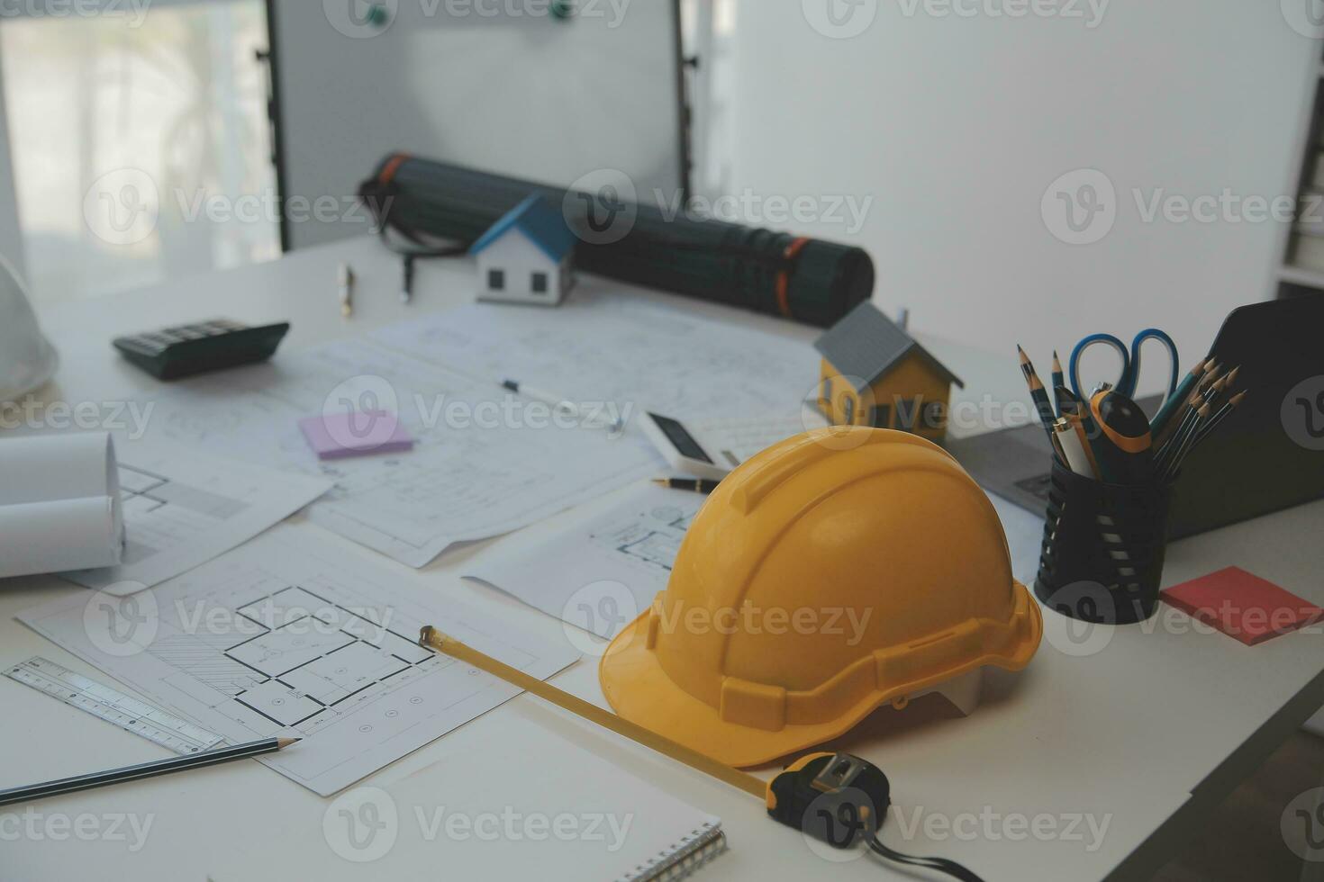 Engineer Teamwork Meeting, Drawing working on blueprint meeting for project working with partner on model building and engineering tools in working site, Construction and structure concept. photo