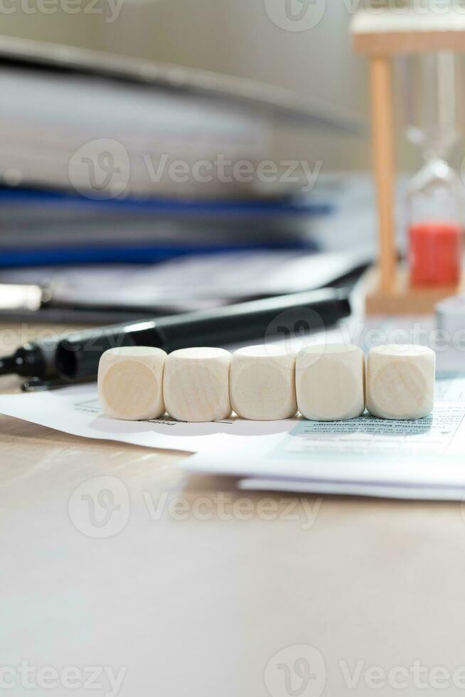 Five wooden dices. Closeup photo
